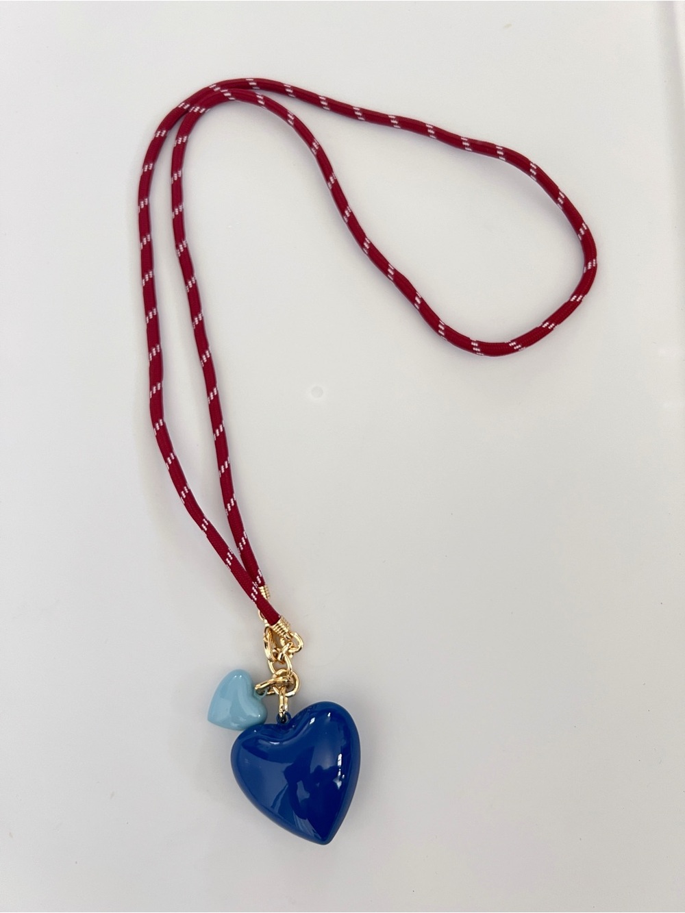 ROXANNE ASSOULIN Red long cord necklace with Navy and small sky Blue hearts